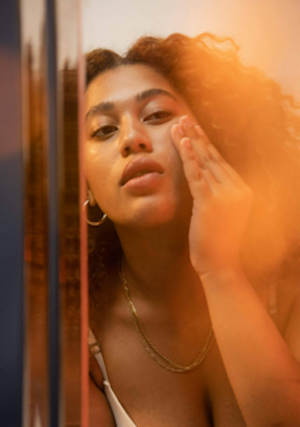 Woman touching face